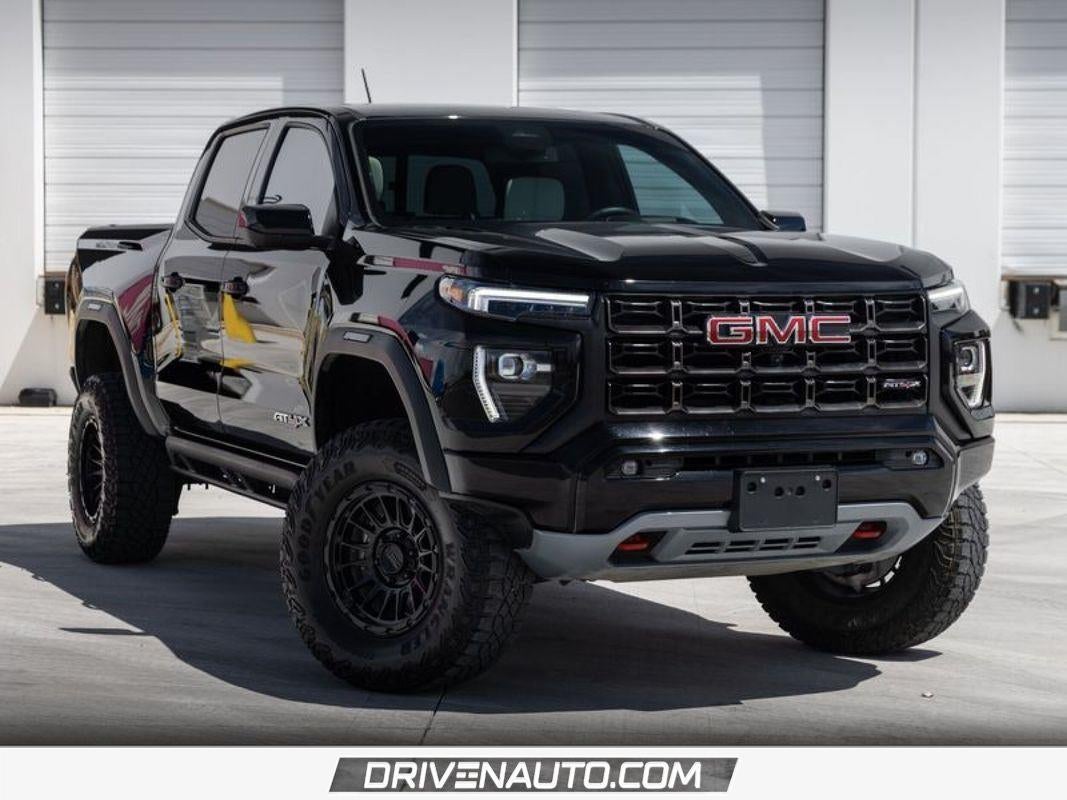 2024 GMC Canyon AT4X in Onyx Black — front three-quarter view