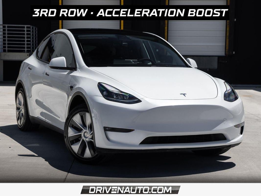 2023 Tesla Model Y Long Range in Pearl White Multi-Coat — front three-quarter view