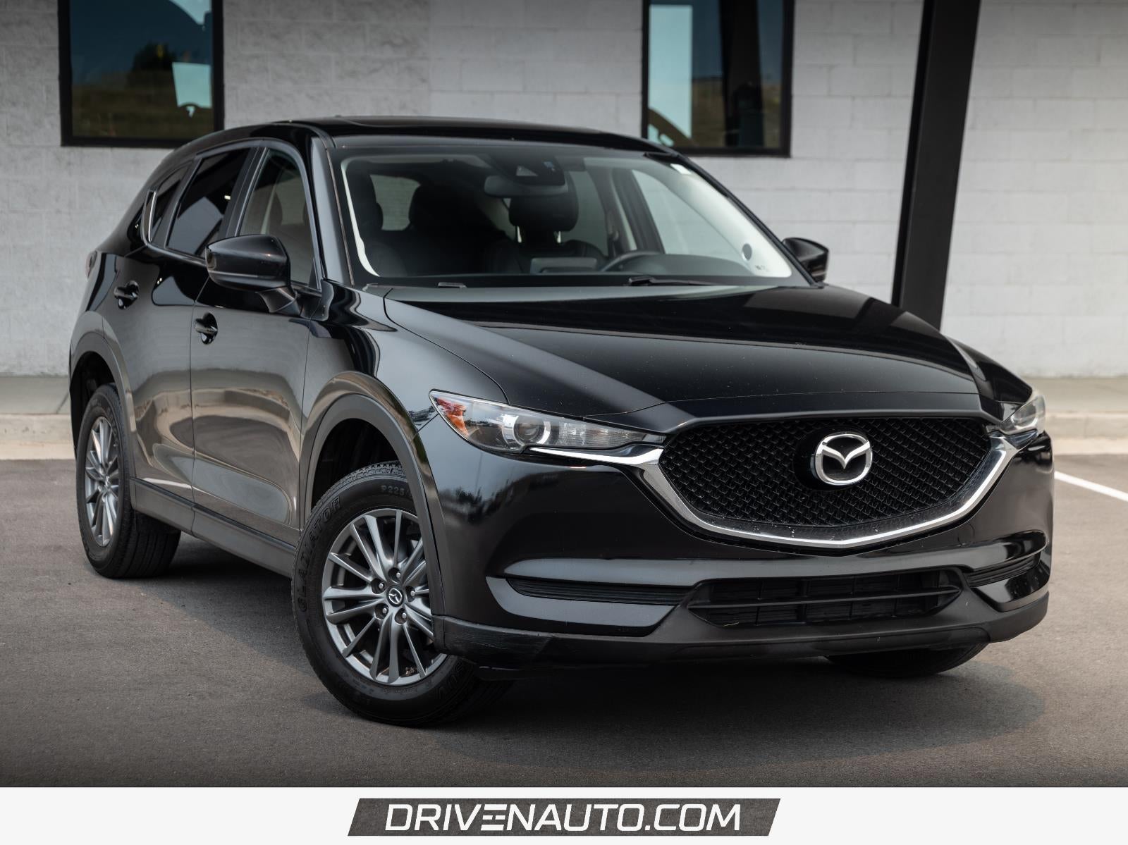 2017 Mazda Mazda CX-5 Touring in Jet Black Mica — front three-quarter view